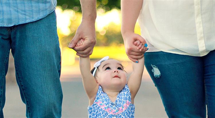 Baby holding hands