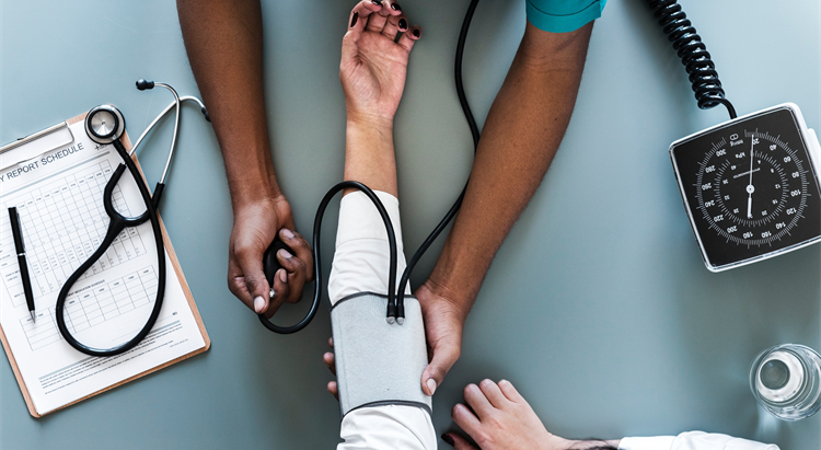 Person having blood pressure checked