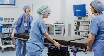 Medican professionals moving equipment