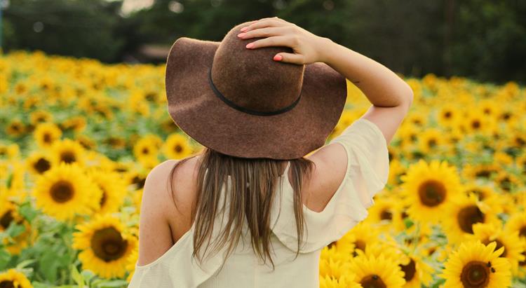 Woman in sunflower field