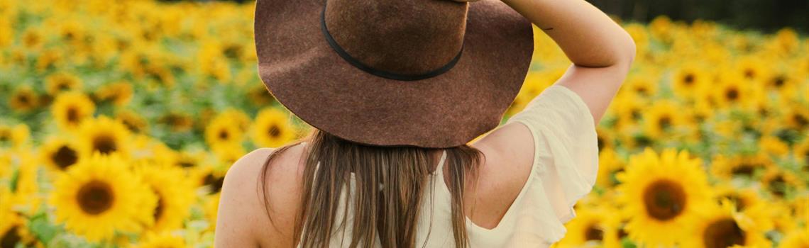 Woman in sunflower field