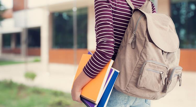 A student wearing a backpack